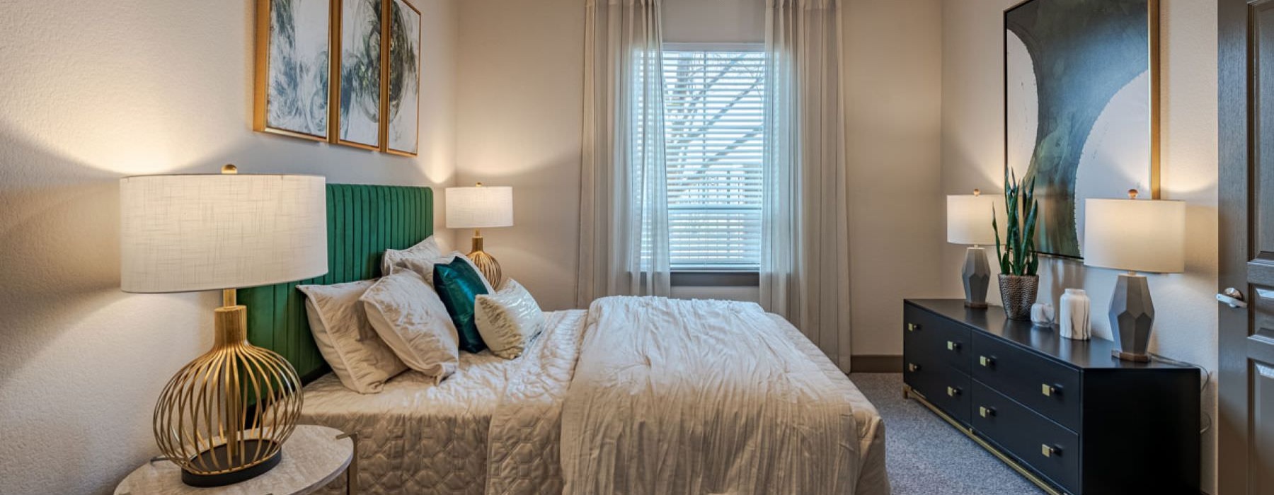a bedroom with a bed and two nightstands